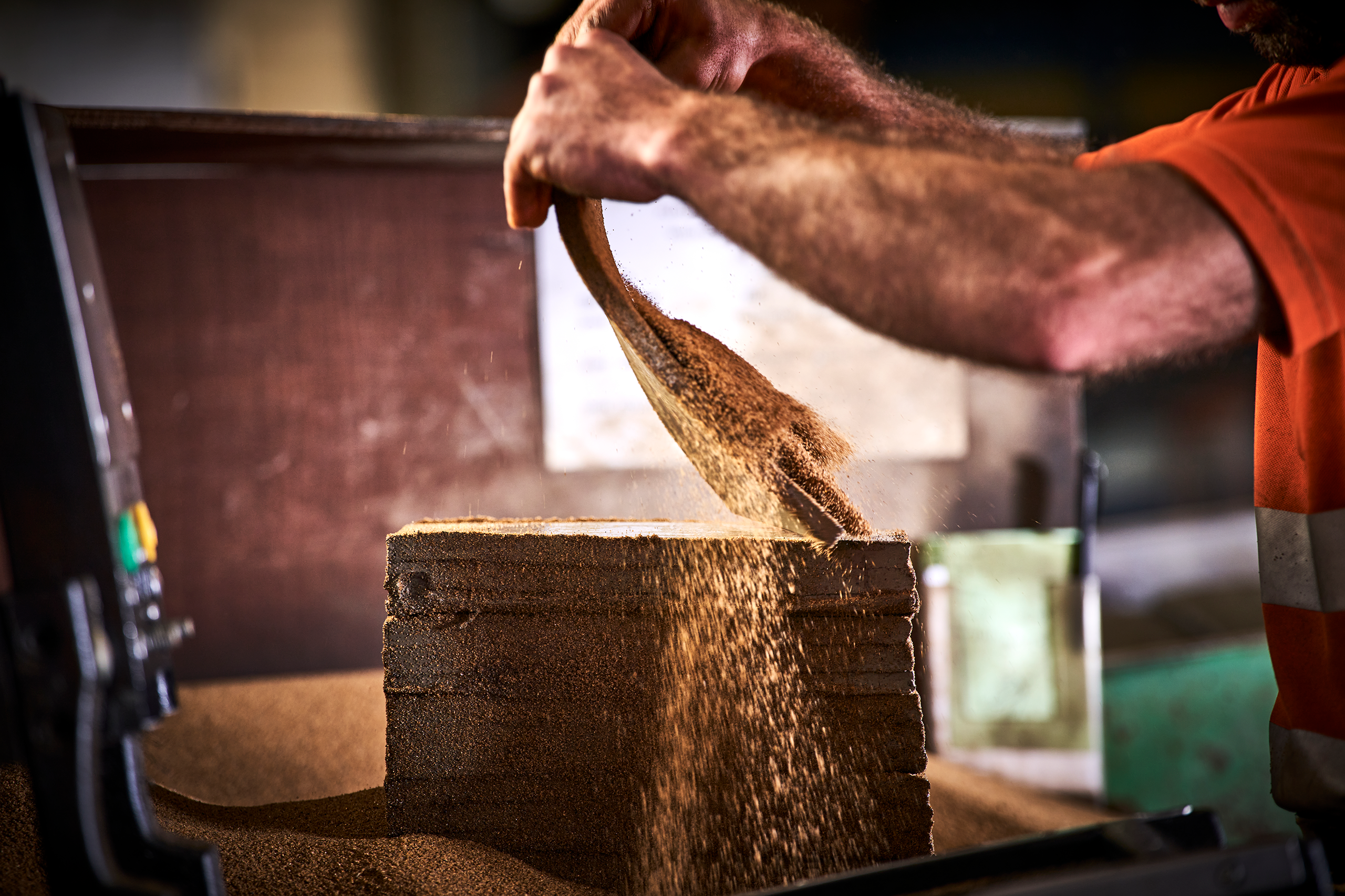 Mans hands close up handmaking clay roof tile