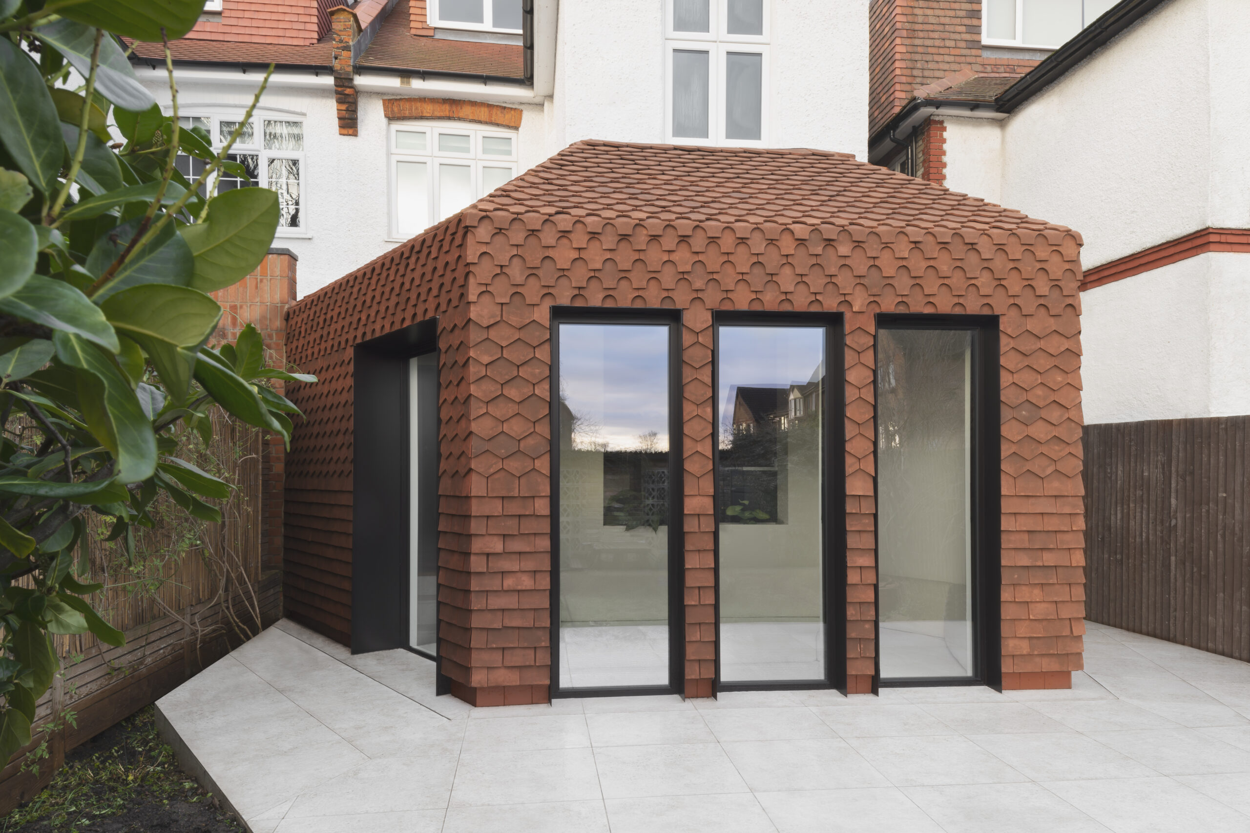 Exterior of new beautiful red clay tile extension in London