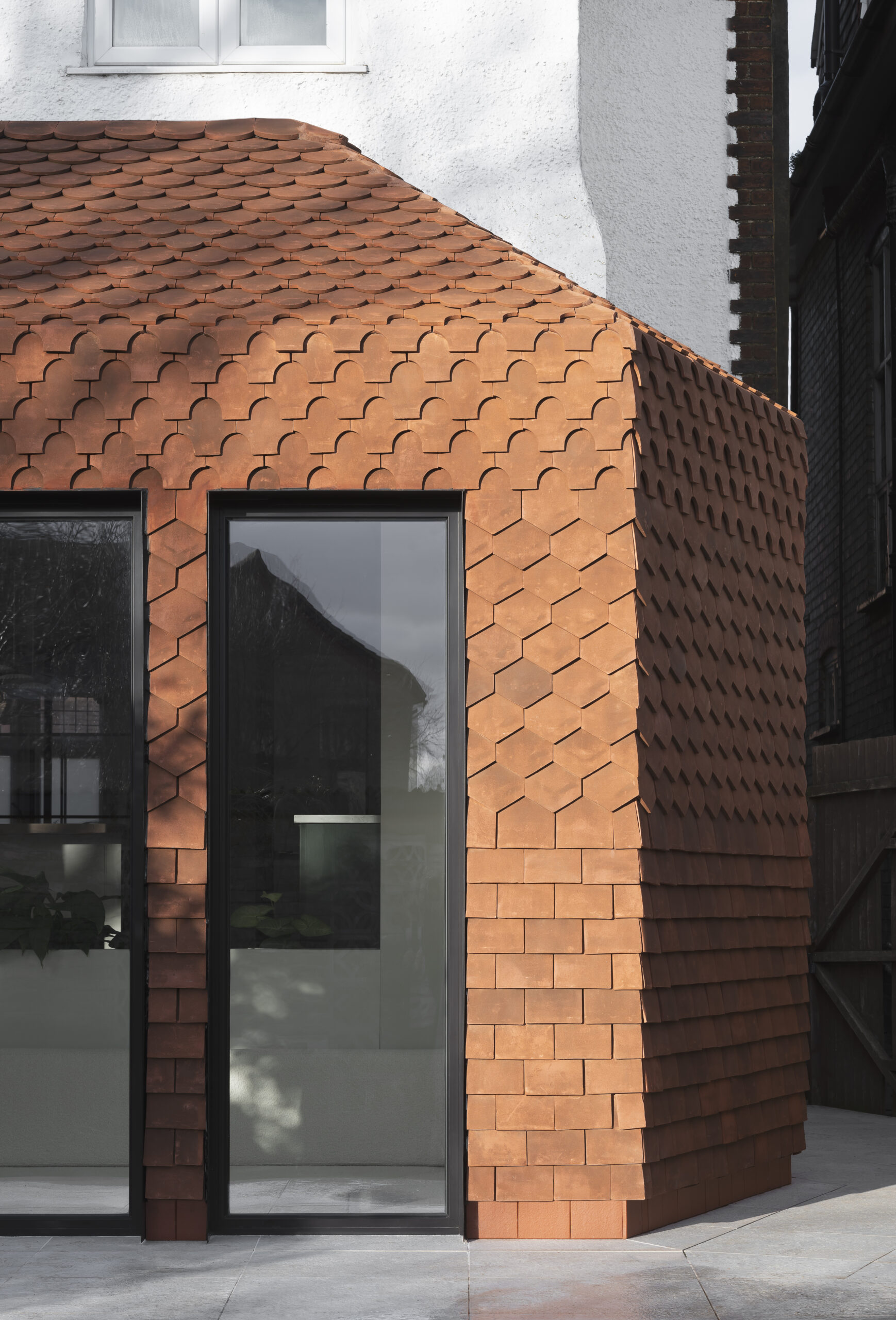 Floor to Ceiling window shown with handmade Goxhill tiles around it